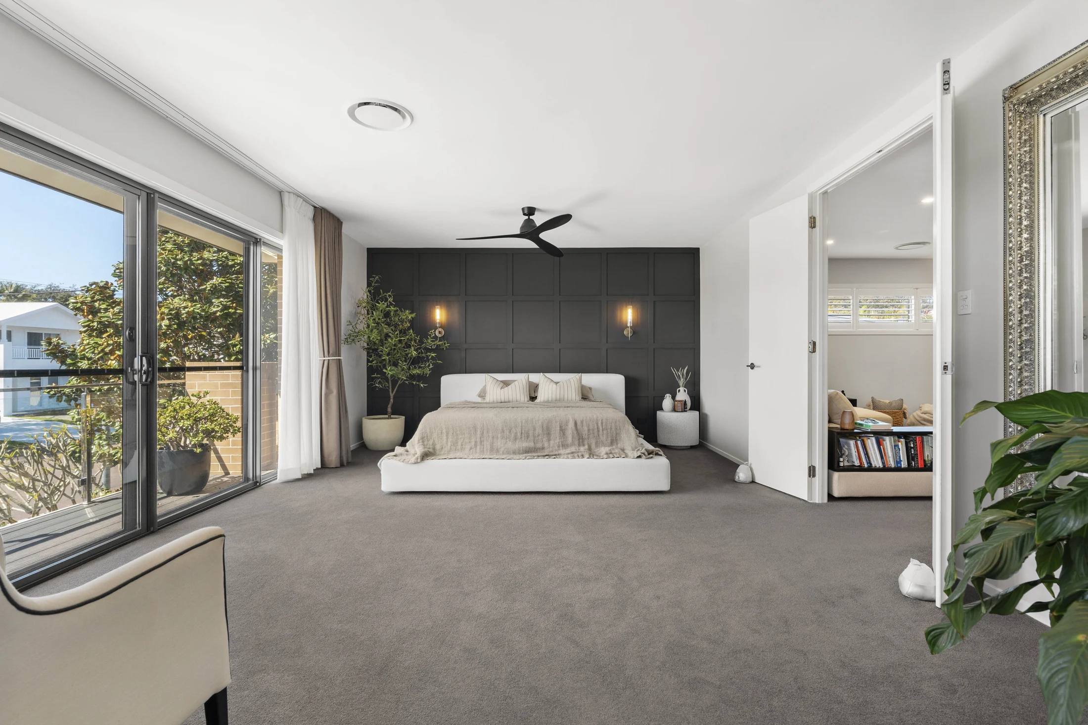 Generous master bedroom opening to a balcony